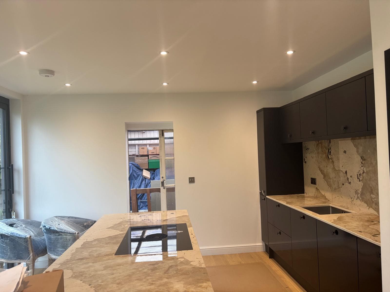 Recessed LED downlights installed in a kitchen ceiling, part of a full rewire by Benjamin Bailey Electrics.